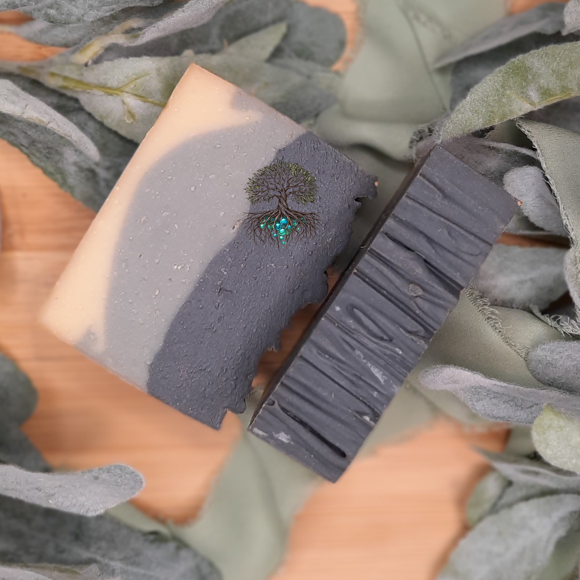 Aurelius hemp soap bar, layered soap bar, white on the bottom light grey middle layer, dark grey top layer. Scented in bergamont and black tea.