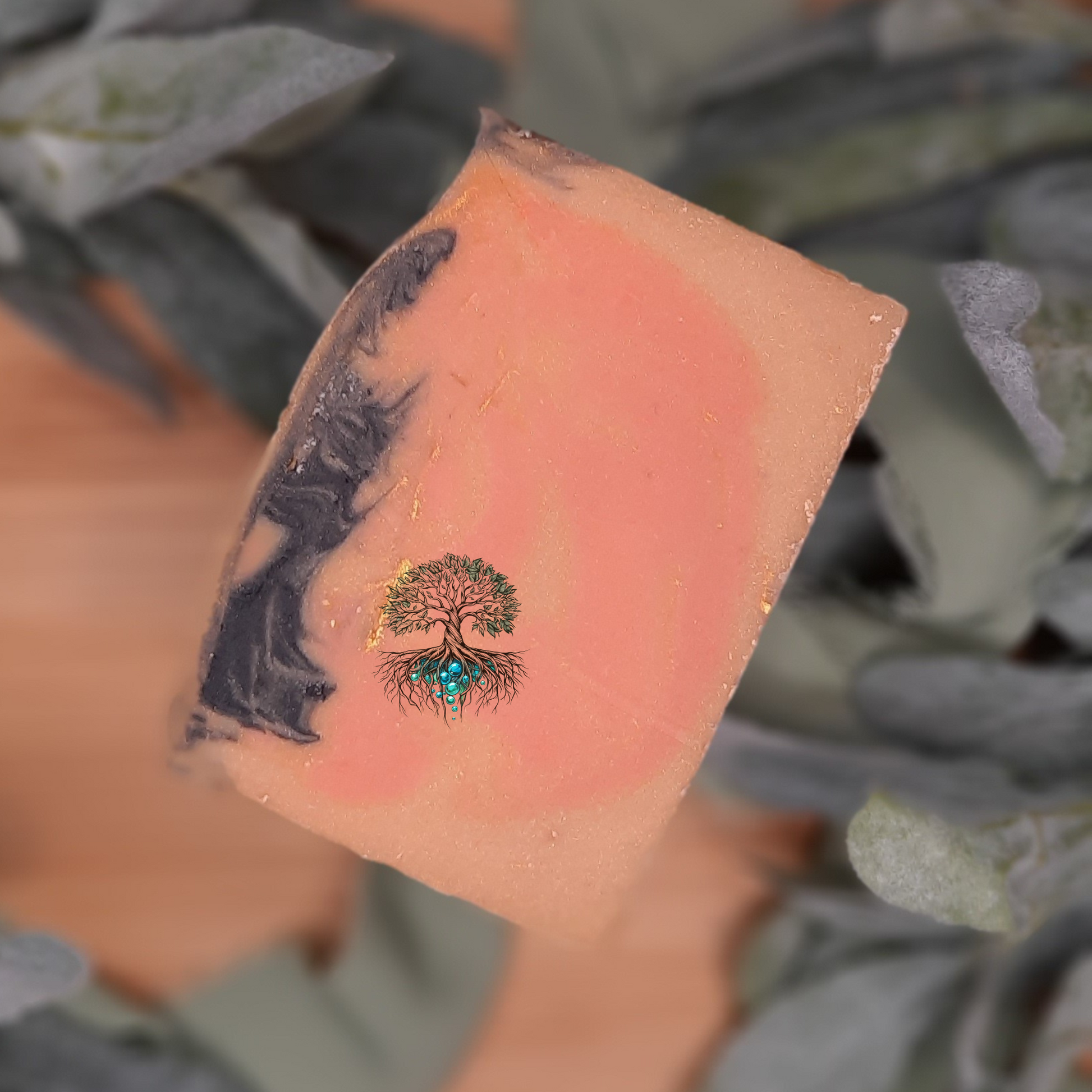 Avalon Hotel hemp soap bar, orange gold and black swirl soap bar with white mica and golden biodegradable glitter top. 