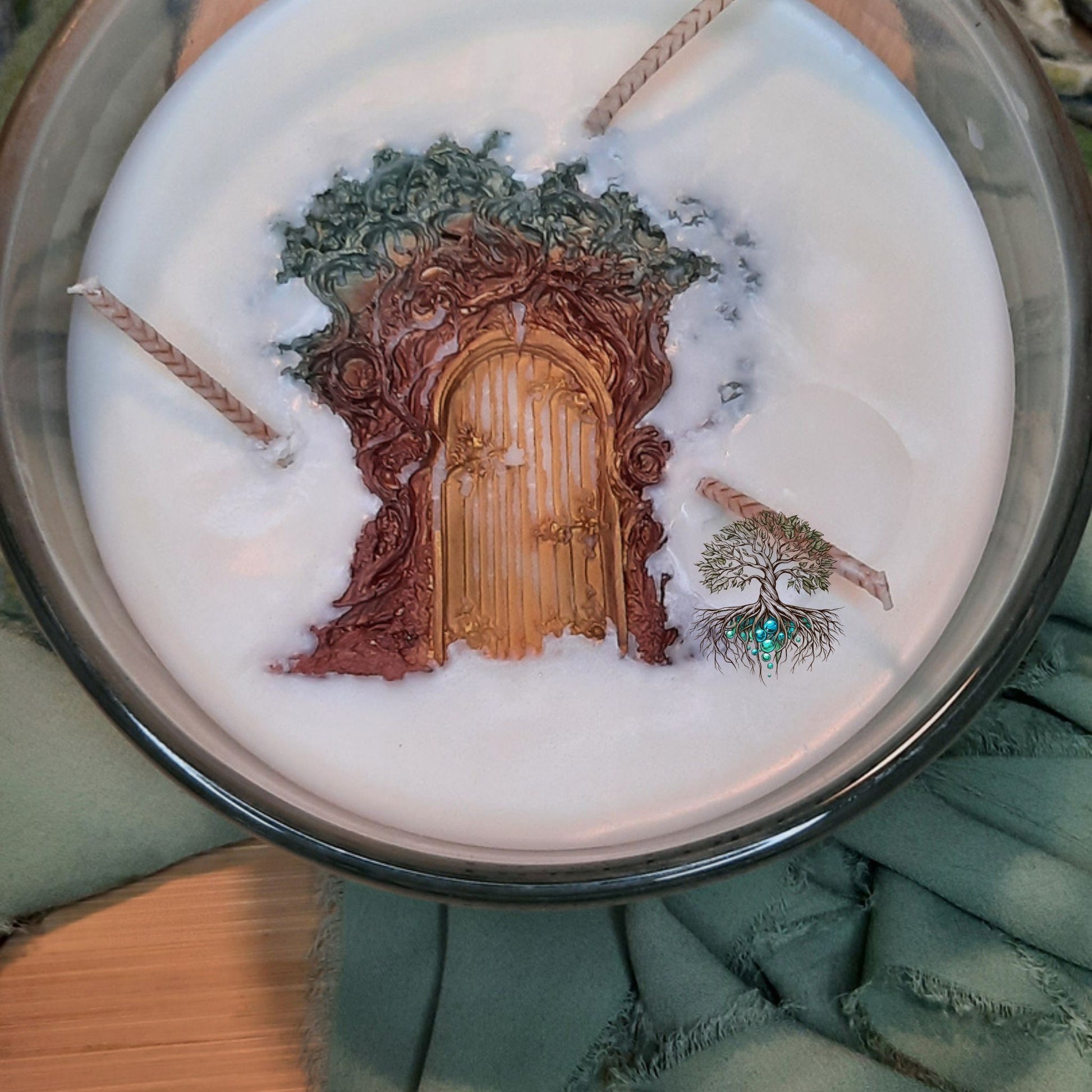 Candle with a decorative tree door design on top