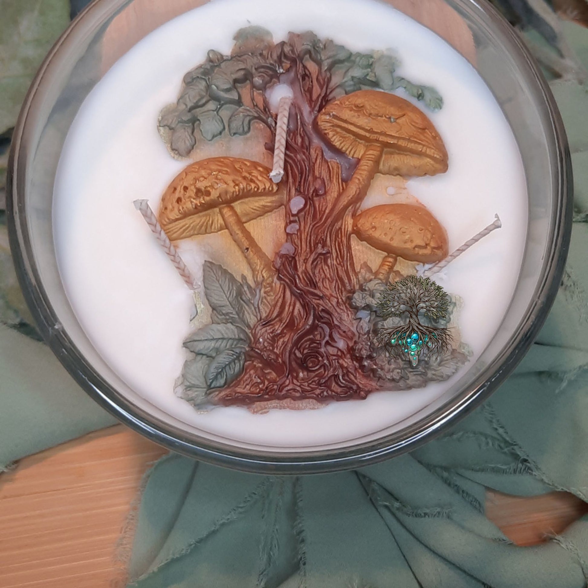 Decorative candle with a tree and mushroom design on top